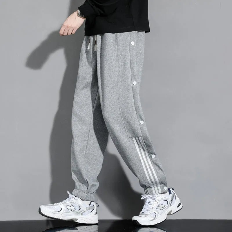 Men's loose fit cotton blend sports trousers with ankle tie fastenings and drawstring waist
