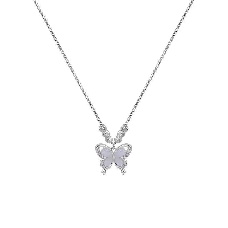 Silver butterfly necklace with opal accents on adjustable cross chain