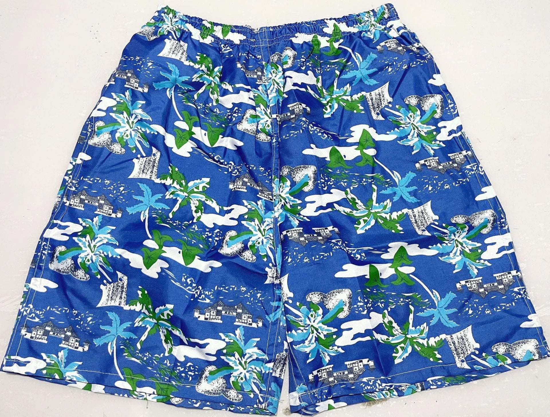 Men's printed five-point swimming trunks with floral pattern in polyester fabric