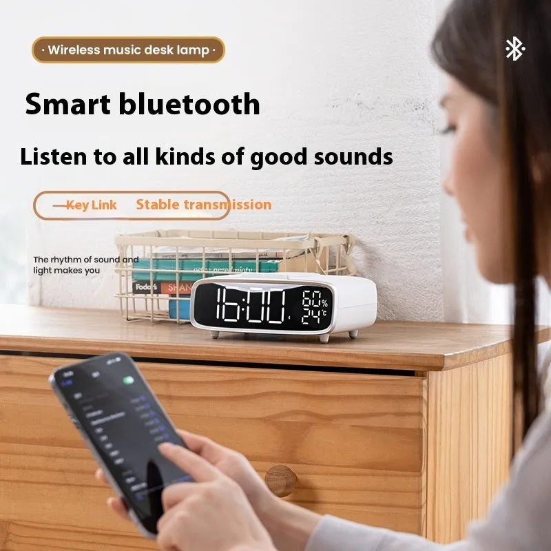 White 3-in-1 wireless charging pad with integrated Bluetooth speaker and soft-glow night light.