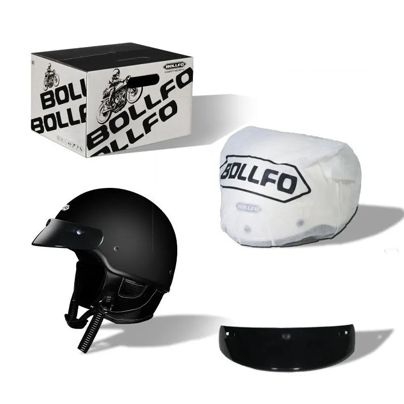 Retro open face motorcycle helmet in matte black, shown from the side on a grey background.
