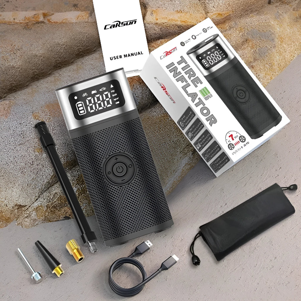 Black portable wireless smart air pump with USB cable, 15cm tube, and nozzle accessories on a grey background.