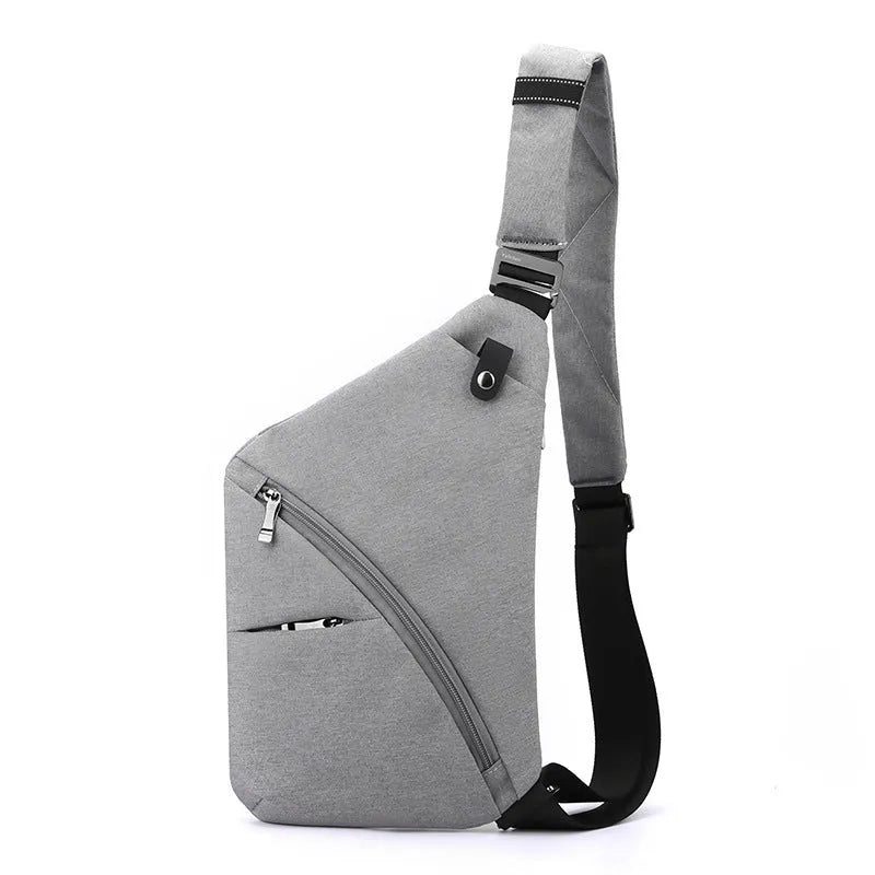 Men's black Oxford cloth chest bag worn across shoulder with letter detail