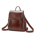 Large genuine leather women's backpack in black with stitching detail and dual straps.