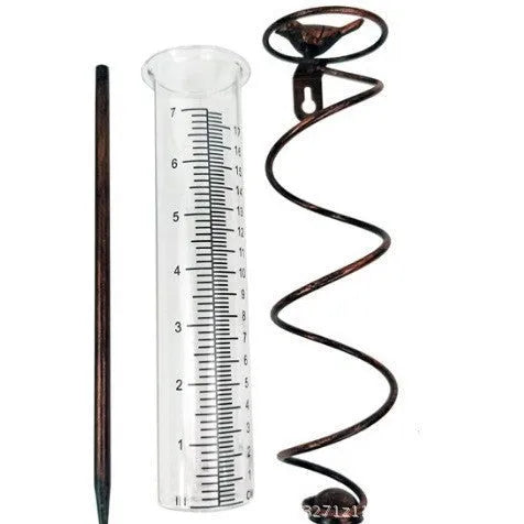 Cast iron and glass outdoor rain gauge with bird design and measurement scale for garden rainfall monitoring