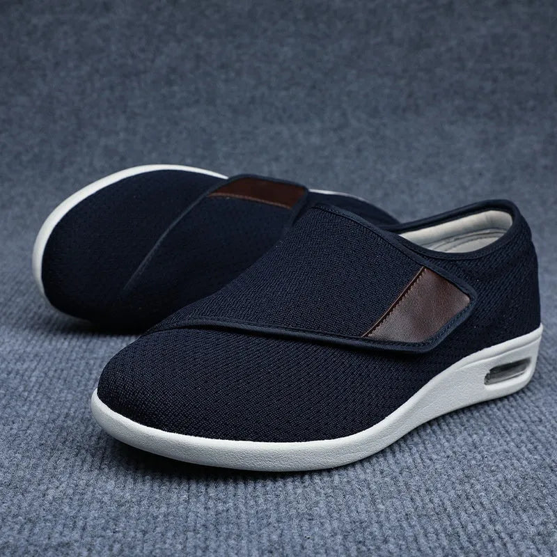 Beige leisure shoe with a velcro strap closure and a rounded toe, shown on a neutral background