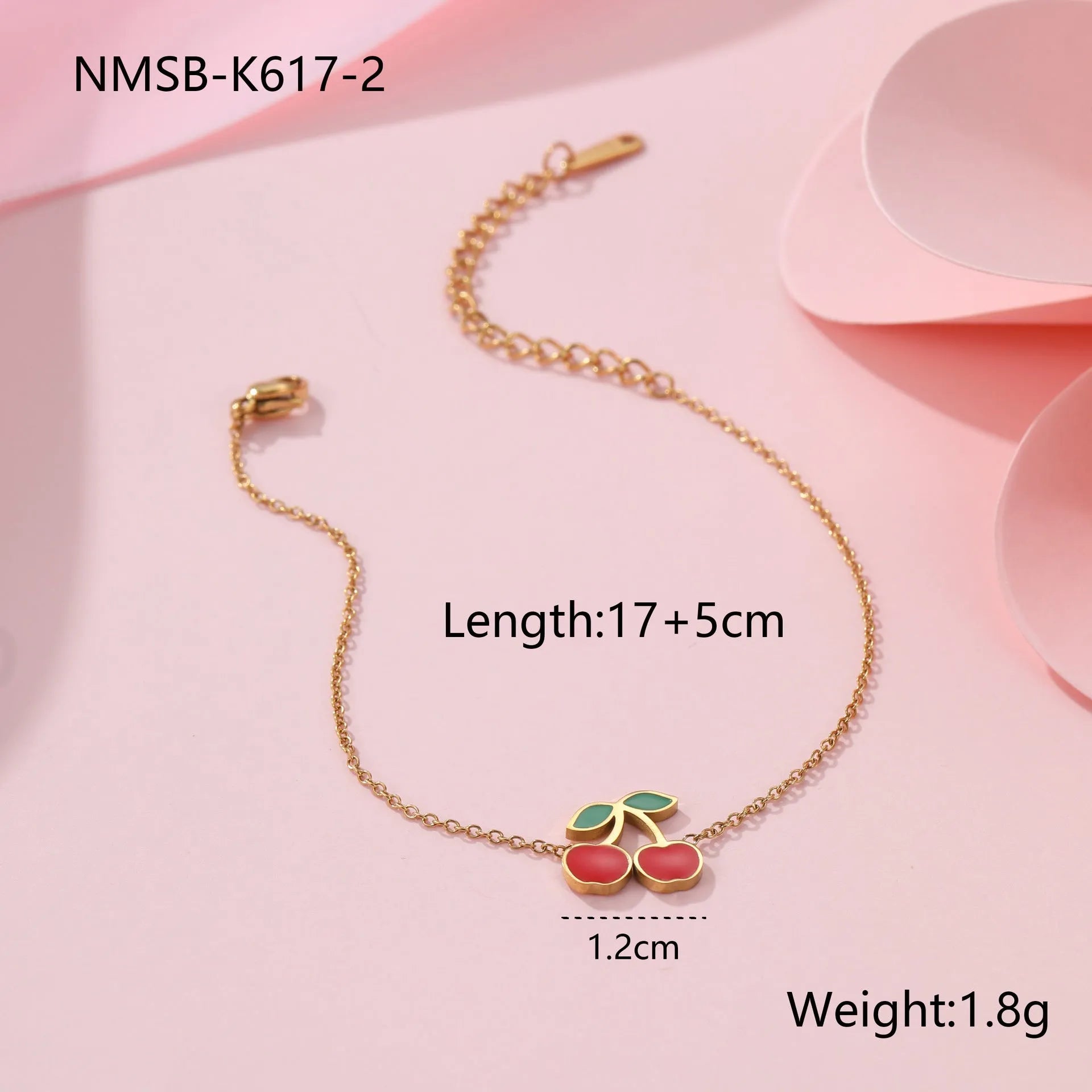 Cherry jewellery set showing necklace, bracelet, earrings, and ring in stainless steel with 18K electroplated finish