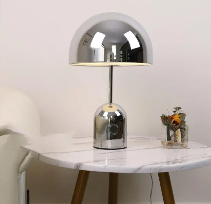Post-modern metal base table lamp in rose gold finish measuring 280mm by 450mm