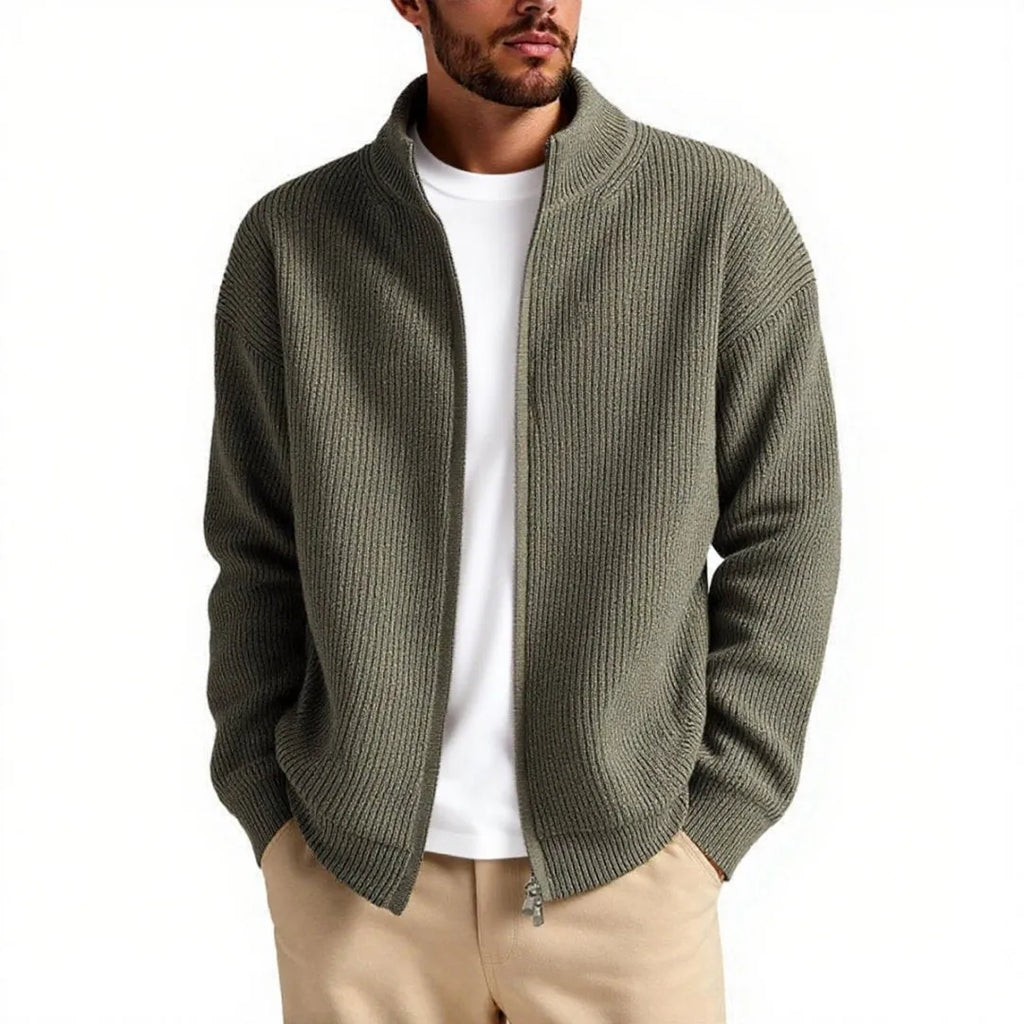 Man wearing a loose grey men's cardigan sweater, a casual acrylic knitwear piece for leisure.