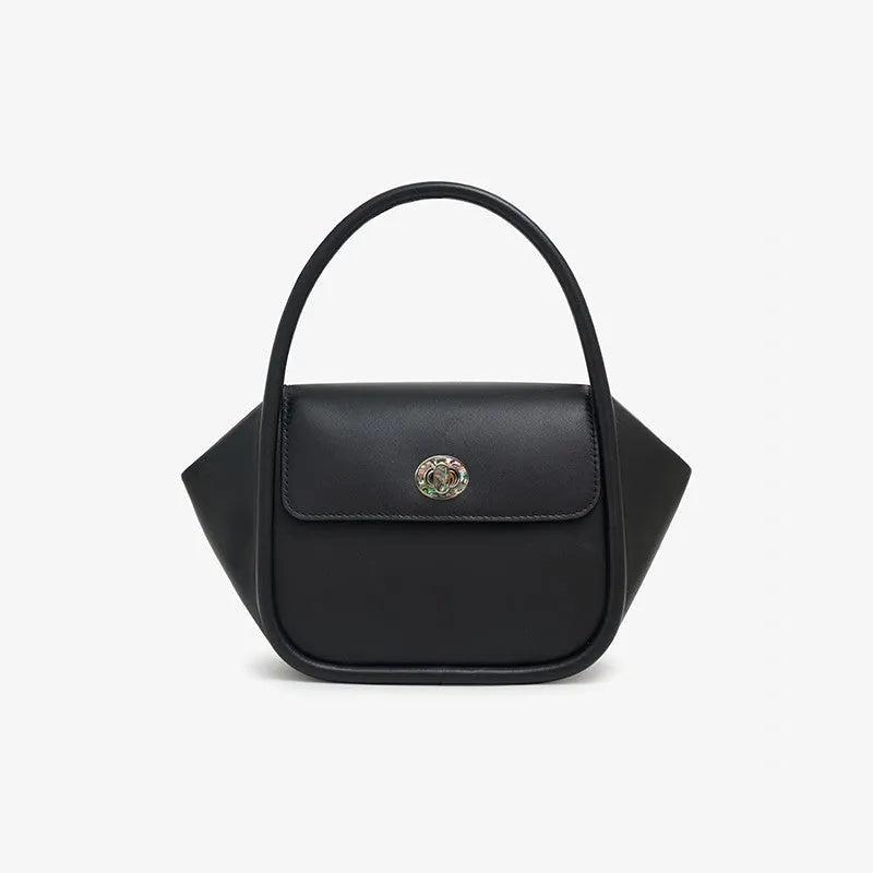 Leather wing bag with latch closure and buckle detailing in cow leather with cross-body strap