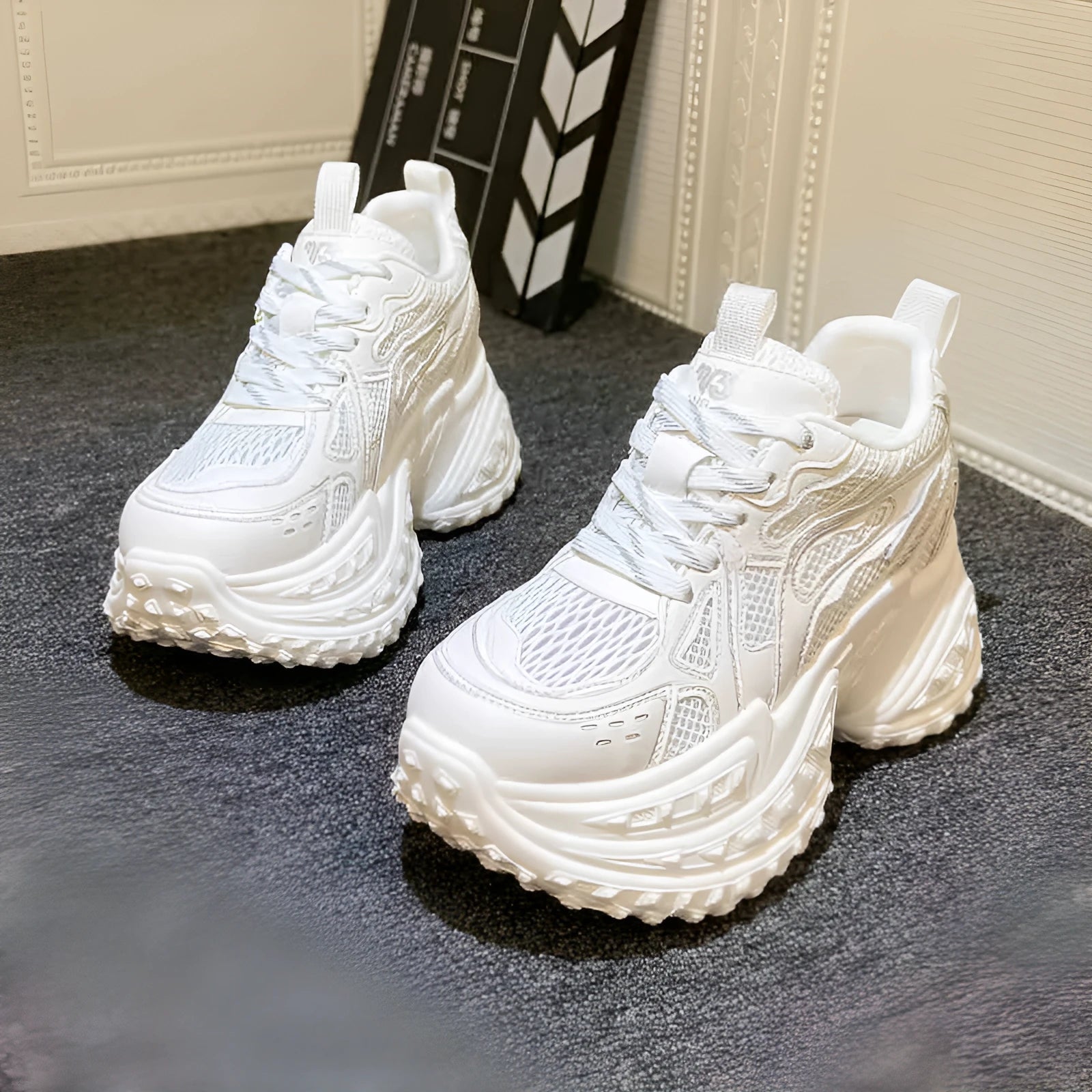 White women's height increasing dad shoes with lace-up closure and round toe, showing internal lift construction