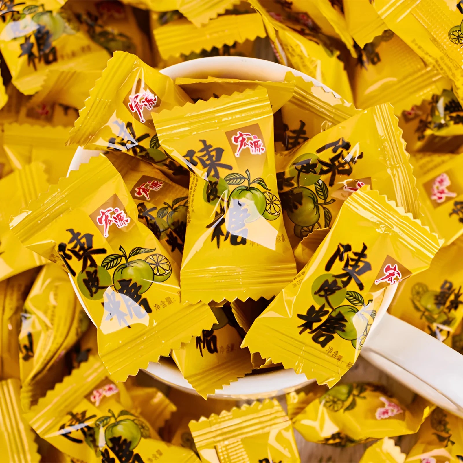 Three separate bags of hard candy: guava flavour, plum sugar flavour, and tangerine peel flavour.