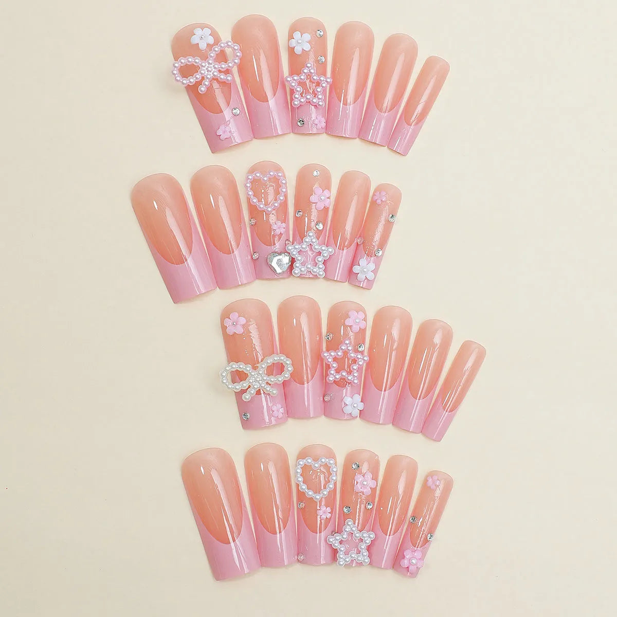 Super long water pipe shaped false nails with a French spot design and decorative bow accent.