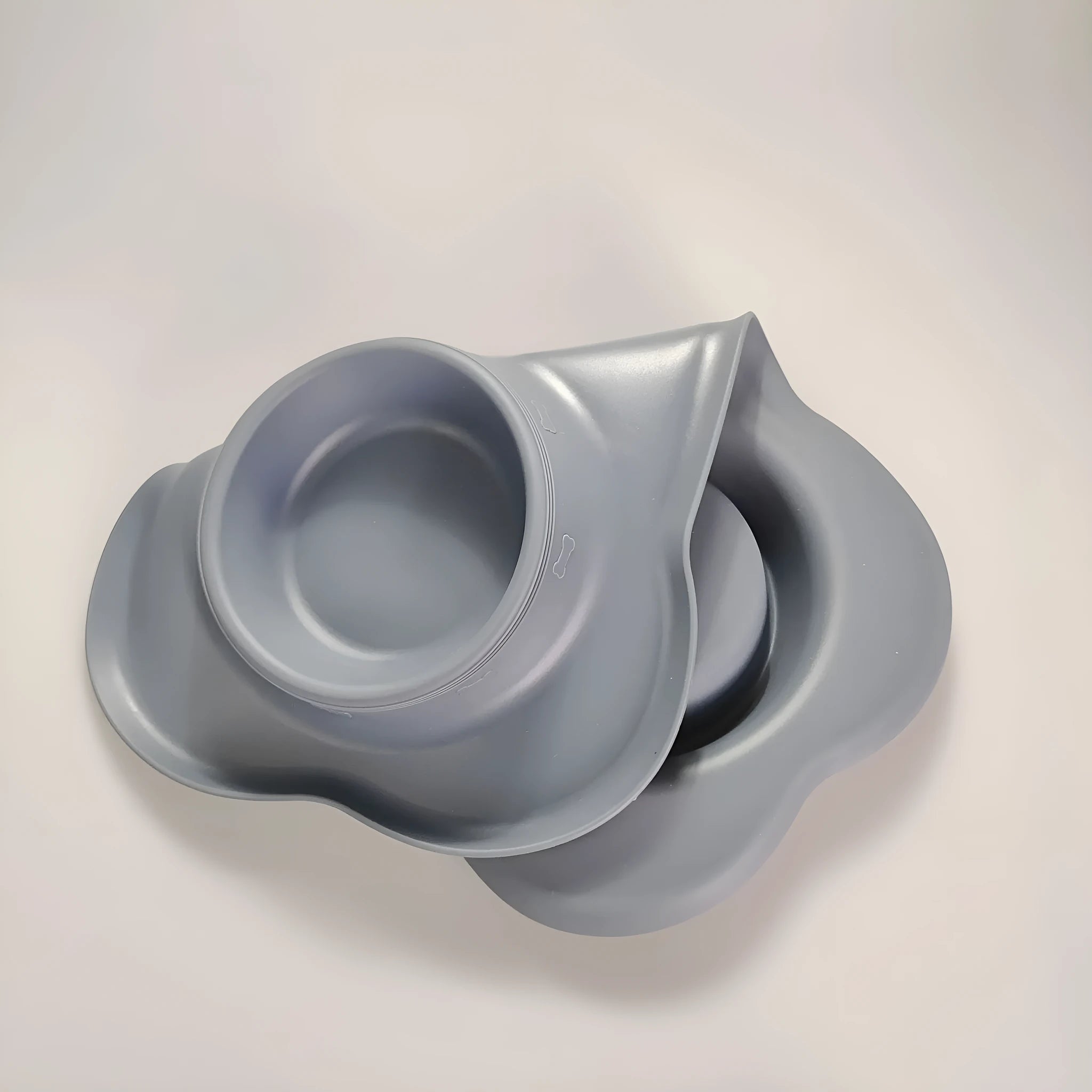 Large double dog bowl with stainless steel inserts in a grey silicone tray for two dogs.