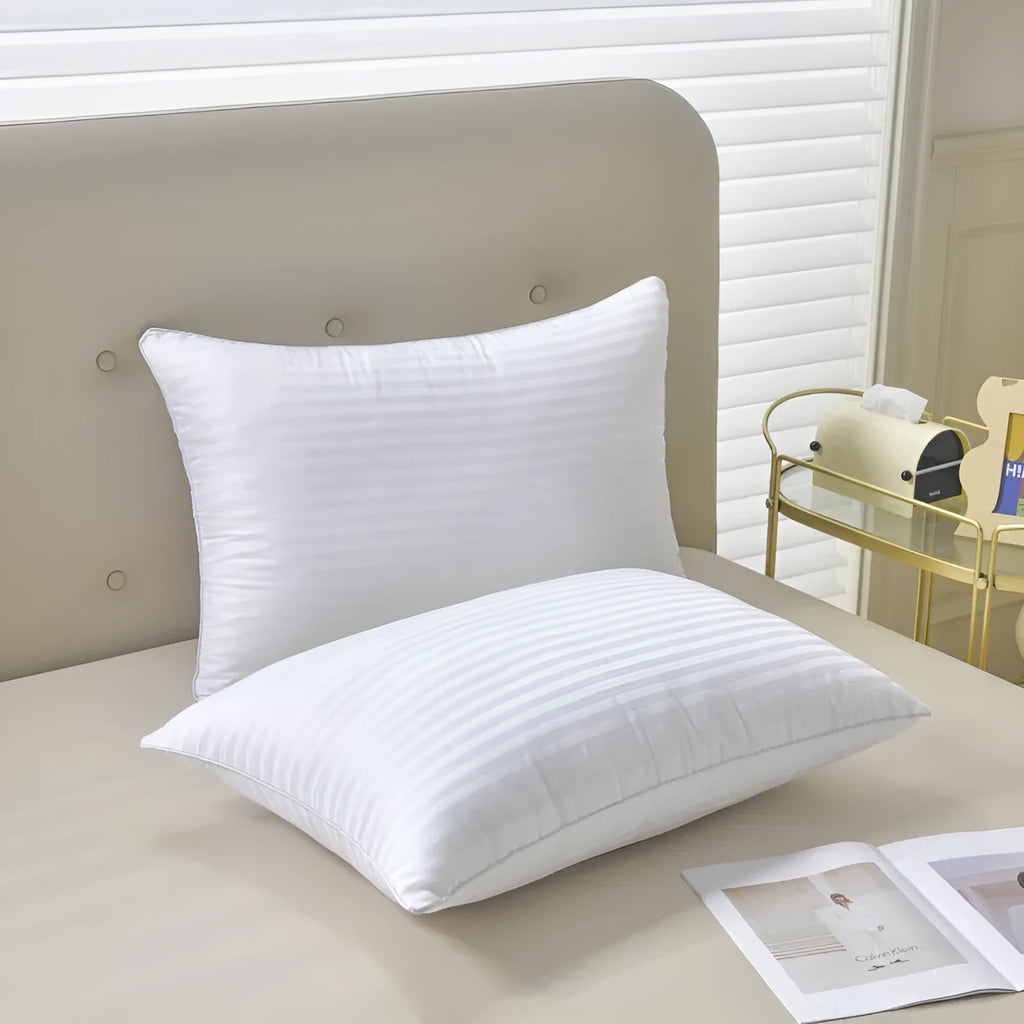 White cotton satin stripe pillow with feather cotton filling, shown in low, medium, and high loft versions.