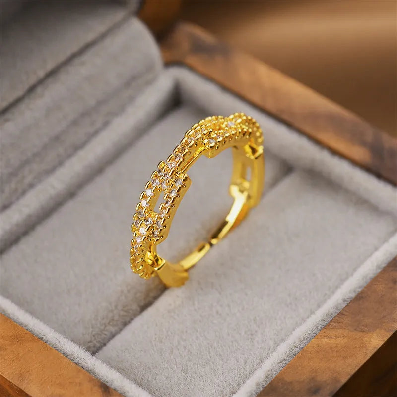 Geometric open women's ring in electroplated gold colour made from copper material