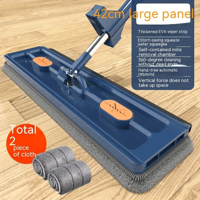 Large flat mop with stainless steel handle and blue rotating mop head on hard floor