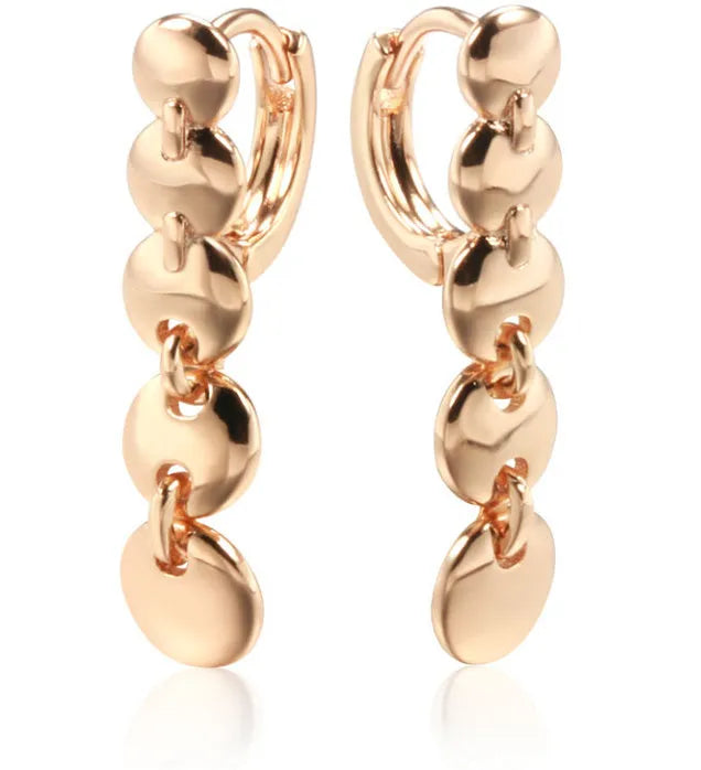 Gold coloured woven copper circle drop earrings with retro design