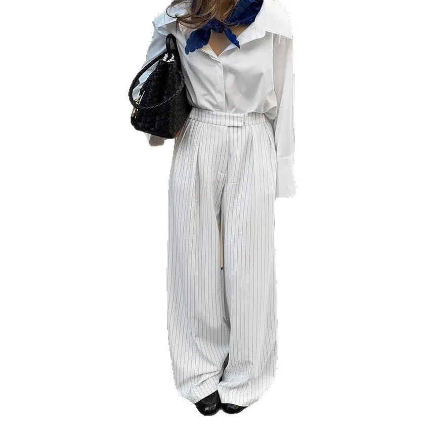 White striped wide-leg women's trousers with zipper, loose fit for commuting.