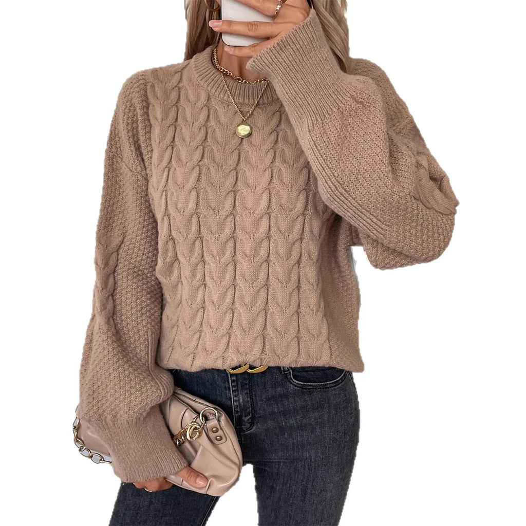 Women's beige loose-fit round neck casual pullover sweater on a hanger.