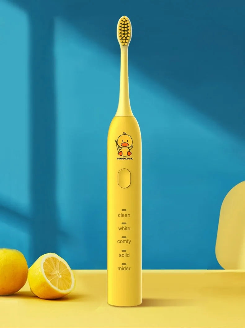 Small yellow duck design electric toothbrush with soft bristles and USB charging port