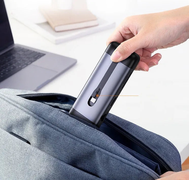 USB-C dock expansion adapter showing multiple ports including HDMI, USB 3.0, and Power Delivery charging