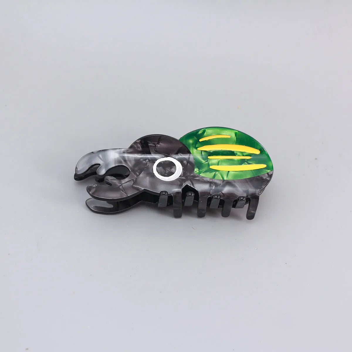 Cellulose acetate sheet Beetle Grip decorative art showing cartoon insect designs in green, orange or white.