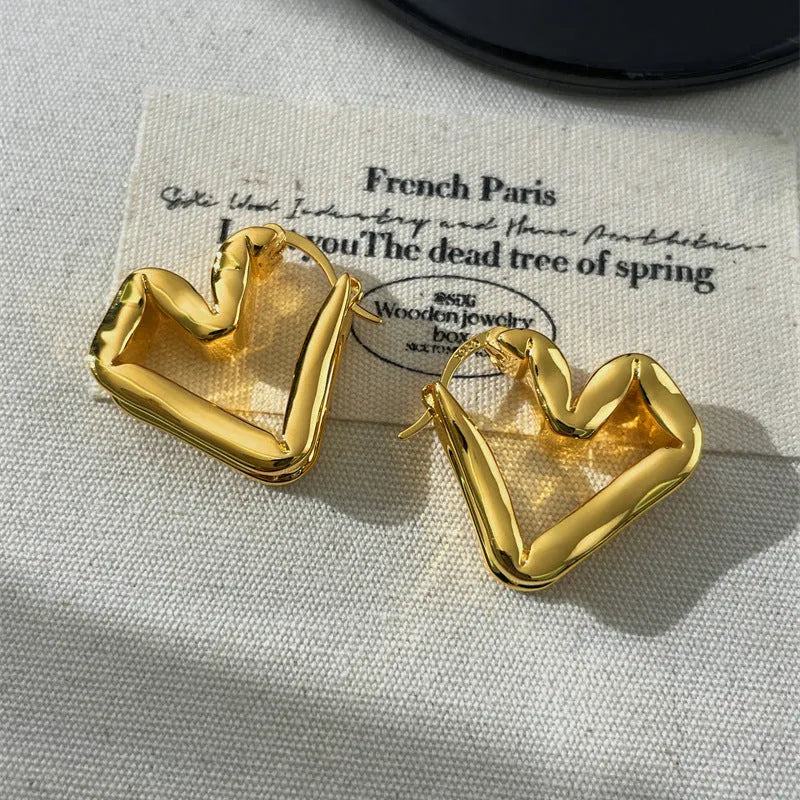 Unisex heart shaped ear clip earrings in gold and silver, retro minority design