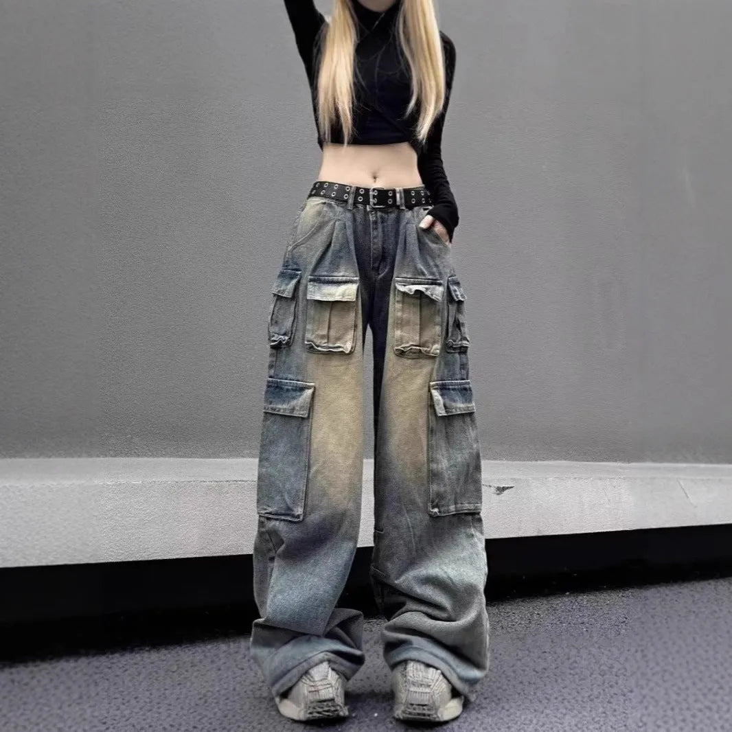 Loose-fit distressed denim jeans with multiple tooling pockets in light blue colour