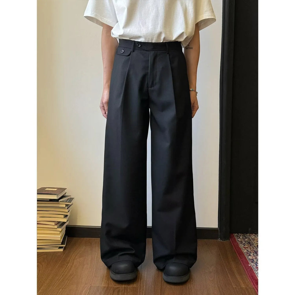 Man wearing straight-leg loose fit casual trousers in brown, showcasing the drape and fit.