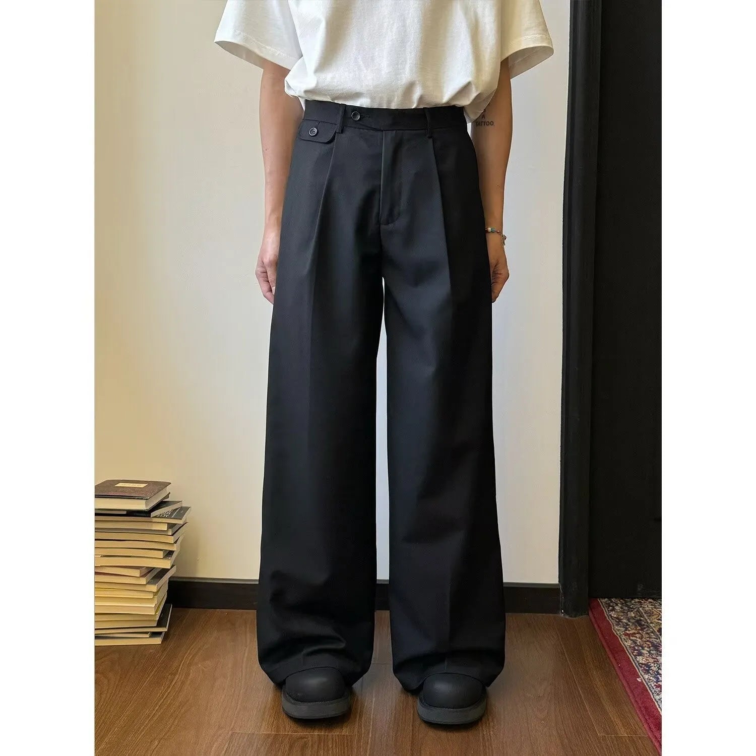 Man wearing straight-leg loose fit casual trousers in brown, showcasing the drape and fit.