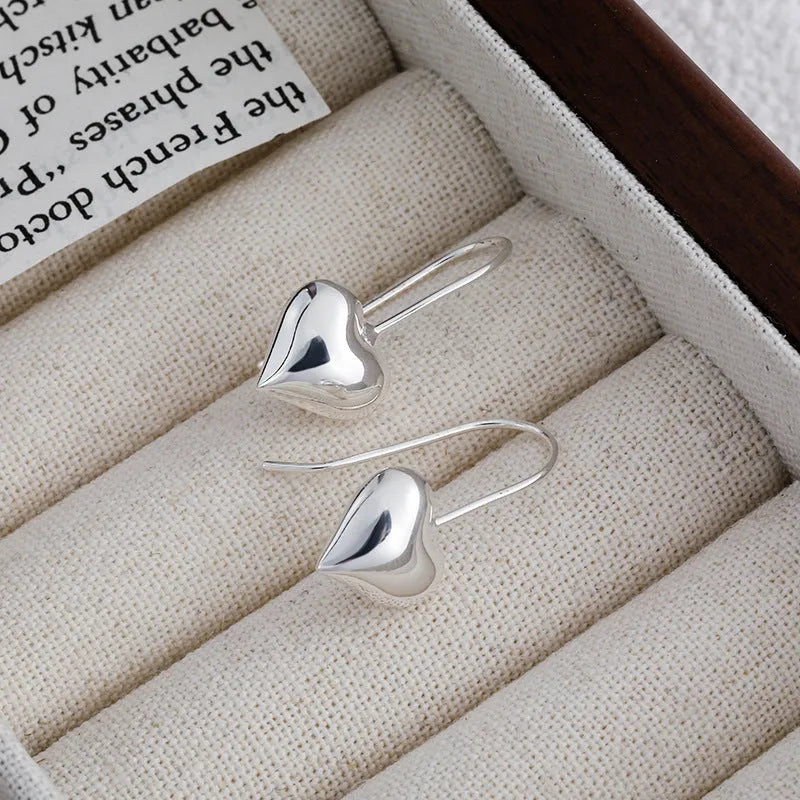 Silver heart earrings with glossy three-dimensional design and Korean style ear hooks