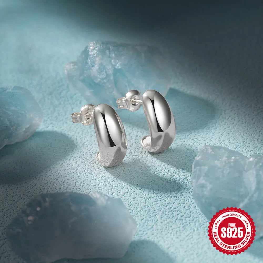 S925 sterling silver C-shaped ringstud earring with glossy electroplated finish in gold or white gold.