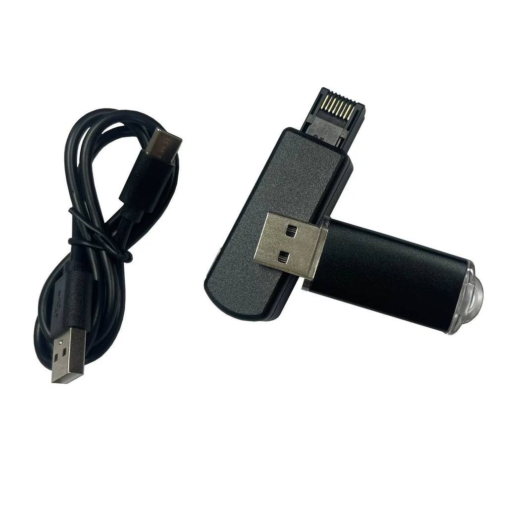 Black aluminium alloy PS4 USB firmware tool with data cable on a dark surface.