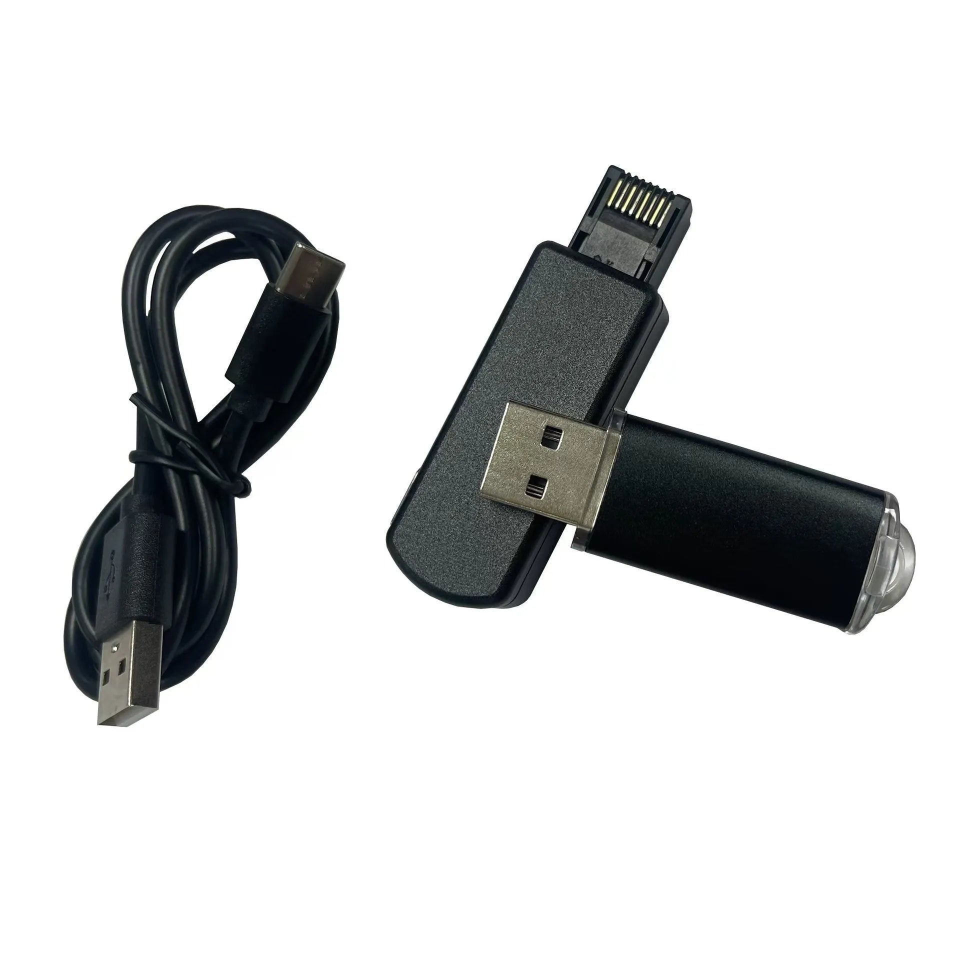 Black aluminium alloy PS4 USB firmware tool with data cable on a dark surface.