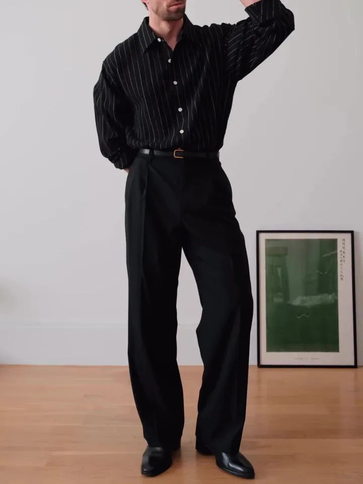 Black pinstriped button-down men's shirt with striped pattern on polyester fabric
