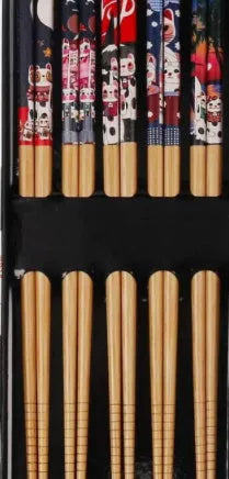 Set of five pairs of bamboo chopsticks with colourful Japanese lucky cat pattern design.