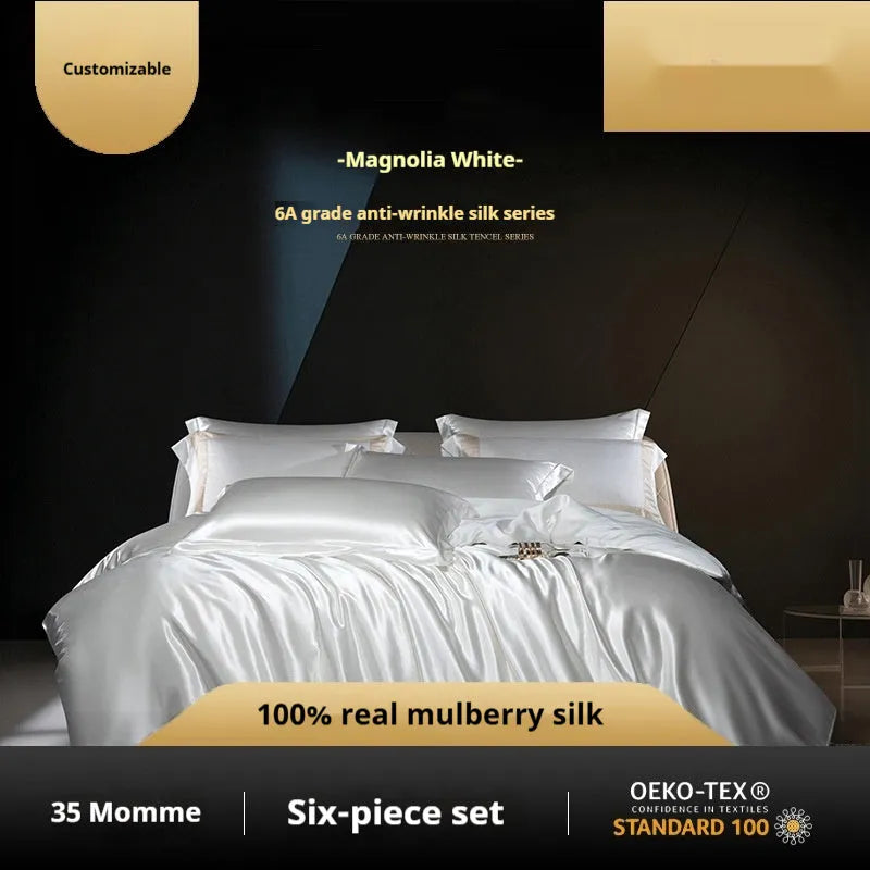 Silk four-piece quilt cover set in solid colour showing champagne gold bedding on bed