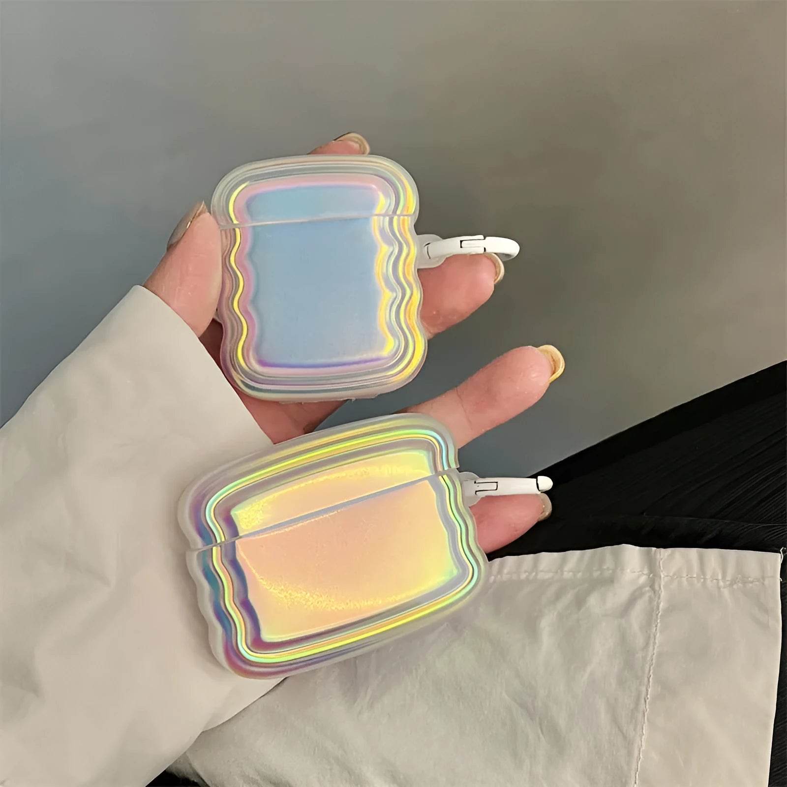 Silicone AirPods case with a colour-changing magic laser ring design on the front.