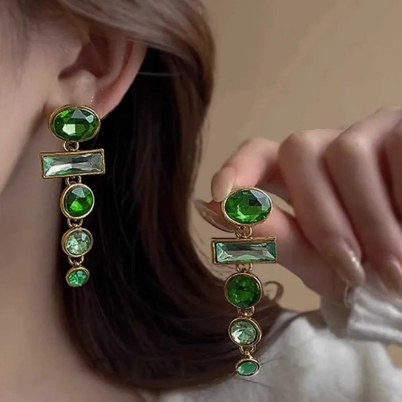 A pair of green gradient geometric drop earrings with alloy construction and inlaid zircon stones.