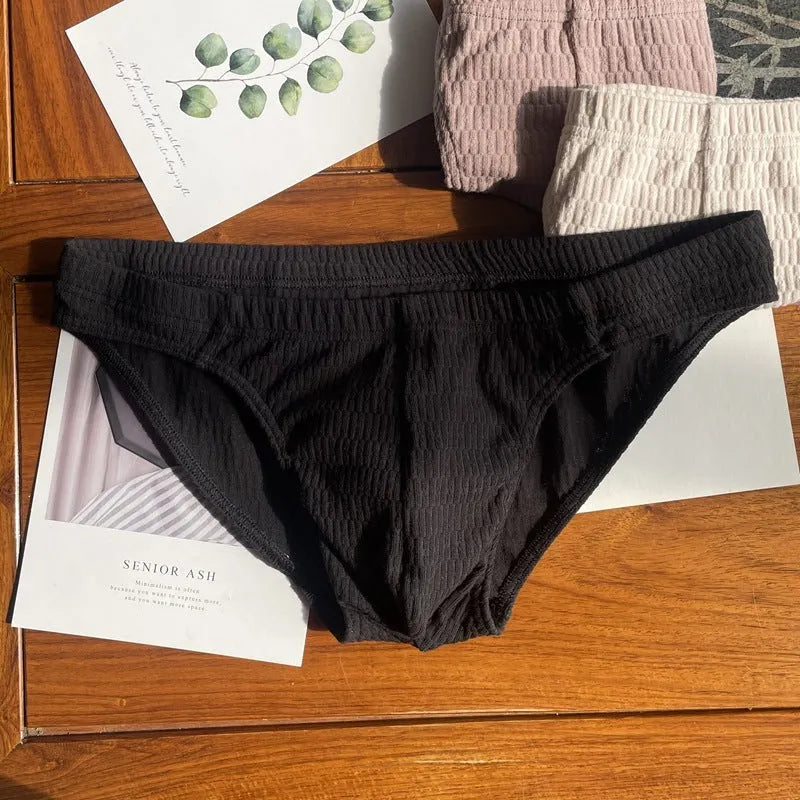 Men's cotton briefs in solid colours showing mid waist and triangle design