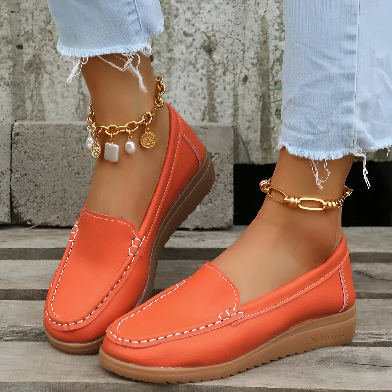 Women's flat loafer shoes in PU leather, showing round toe and car suture detail, on a rubber sole.