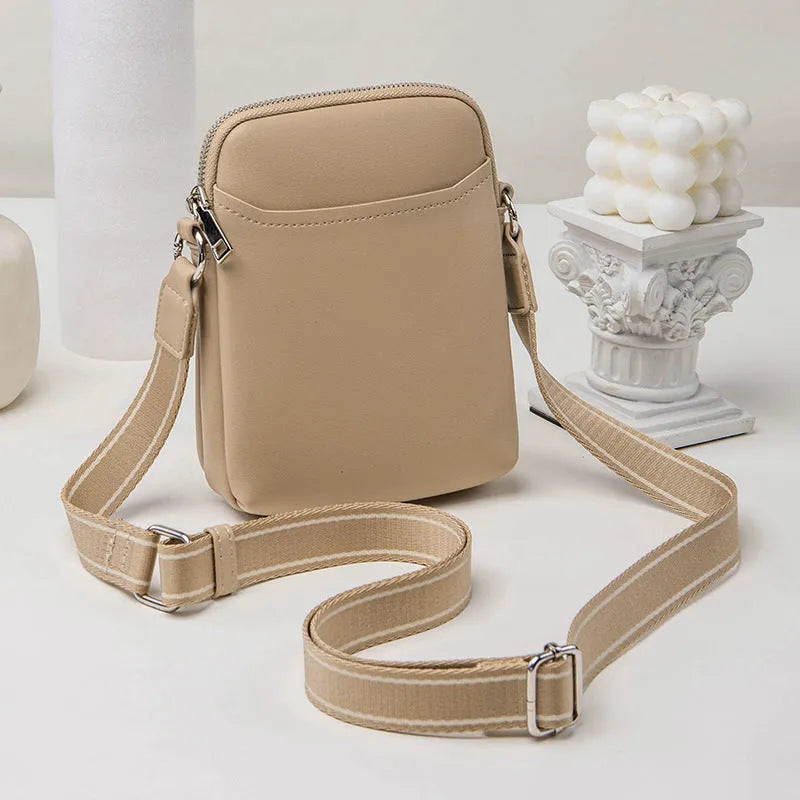 Solid colour small crossbody shoulder bag in PU leather measuring 14.5cm by 5.5cm by 19cm