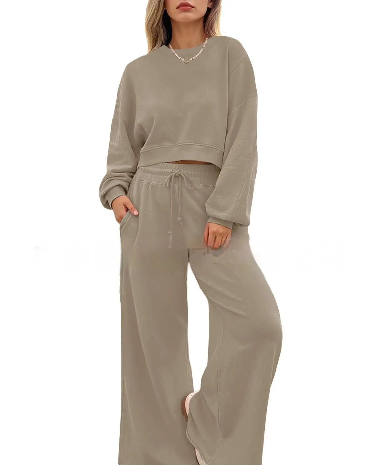 Women's solid colour polyester two-piece casual set with long sleeves and trousers.