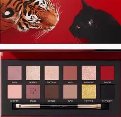 Explorer twelve-colour animal eye shadow palette showing golden tiger, red fox, and spotted tiger designs