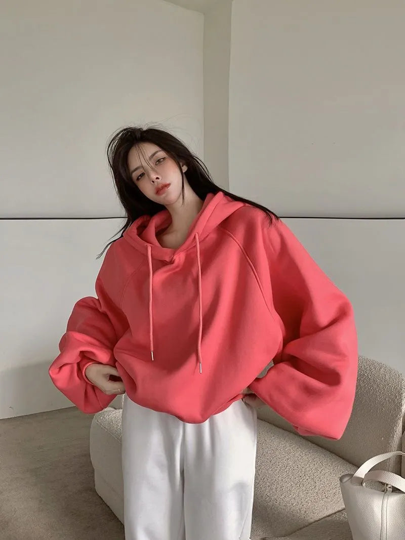 Women's loose mulberry silk hooded sweater in solid watermelon red, sleeveless design.