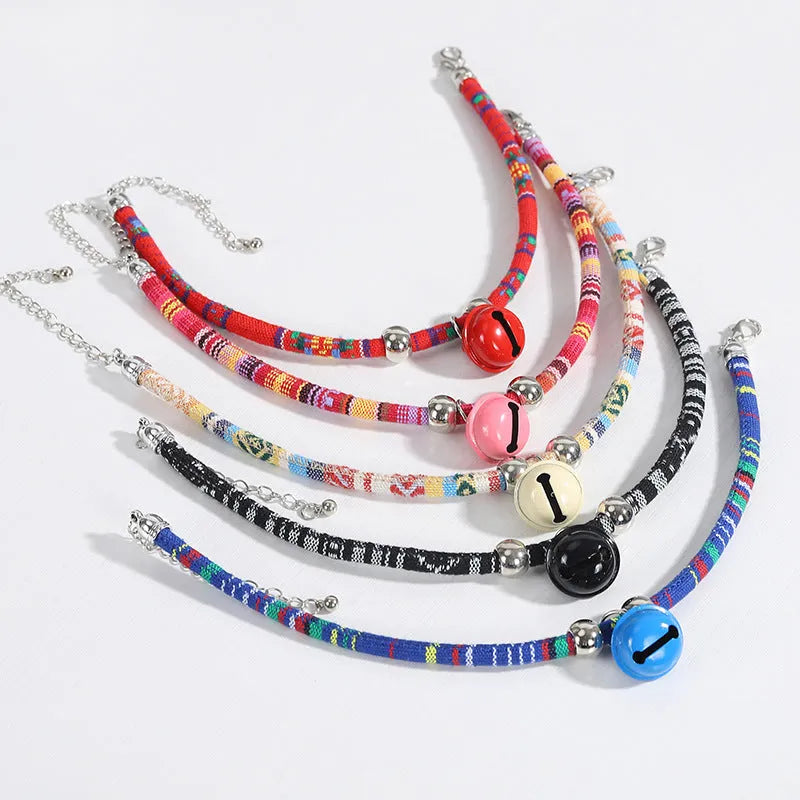 Ethnic patterned adjustable pet collar with a small bell in multiple colour options