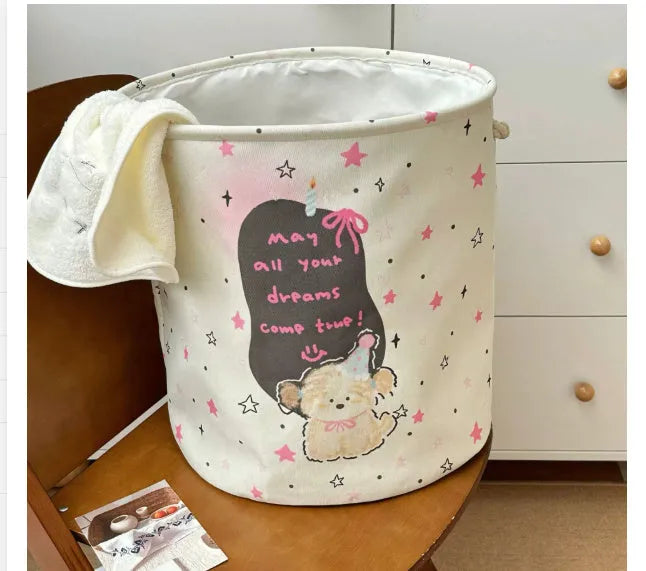 Foldable cotton laundry basket in a colourful design, shown unfolded for use.