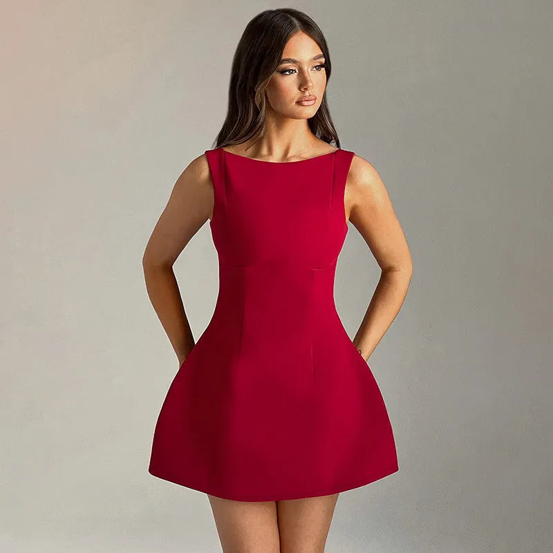Slim-fitting backless sling dress with high waist and short skirt in a choice of colours.