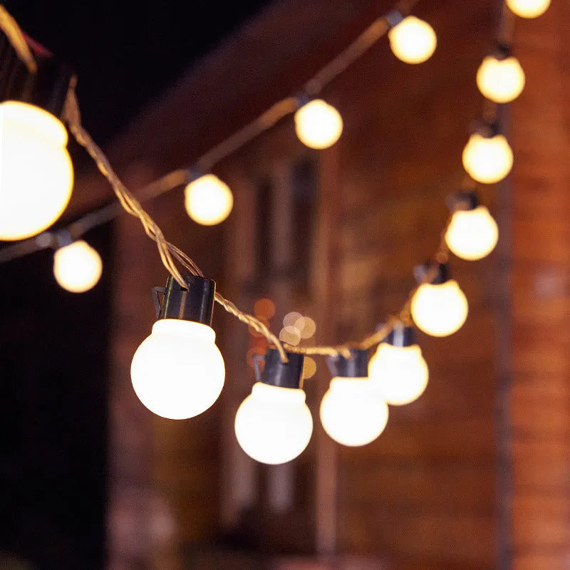 Solar-powered retro decorative string lights for festival tents with black wiring and LED lamps
